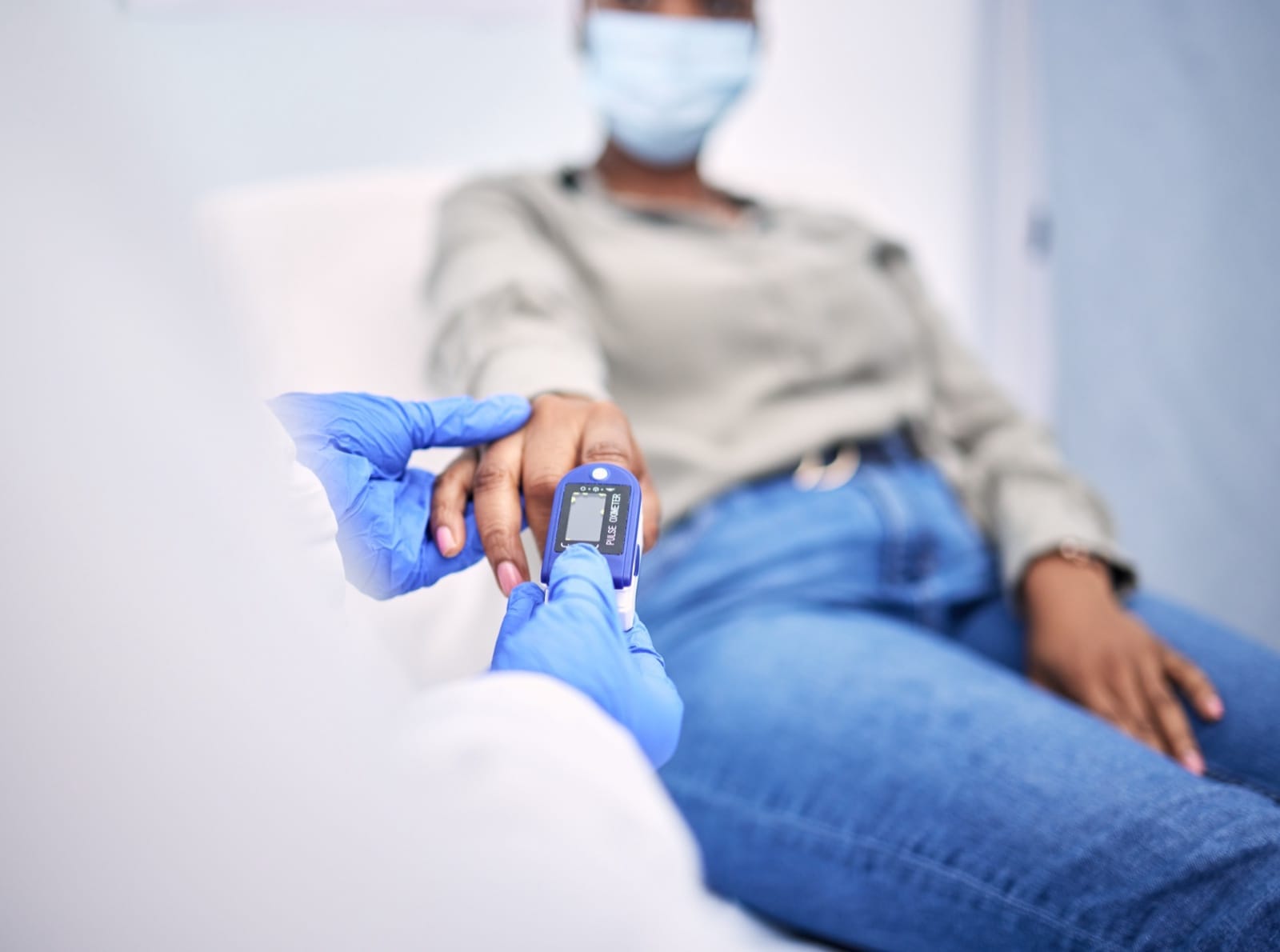 A clinician monitoring a patient during a vascular health assessment