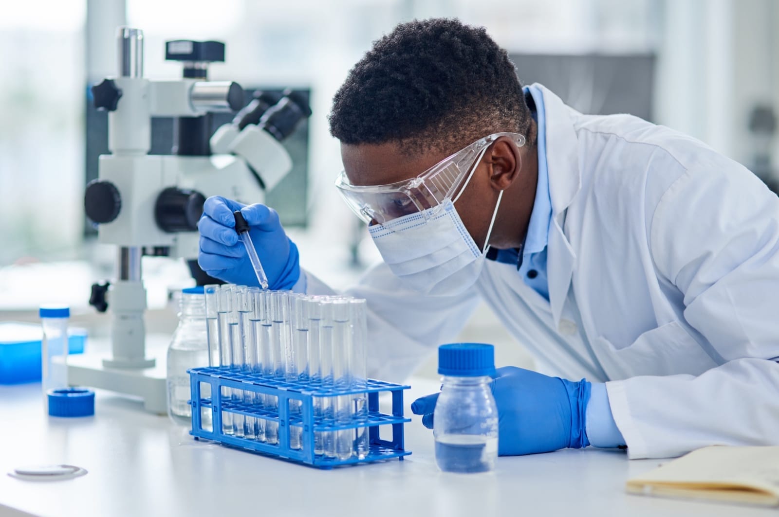 A laboratory scientist examining diagnostic samples
