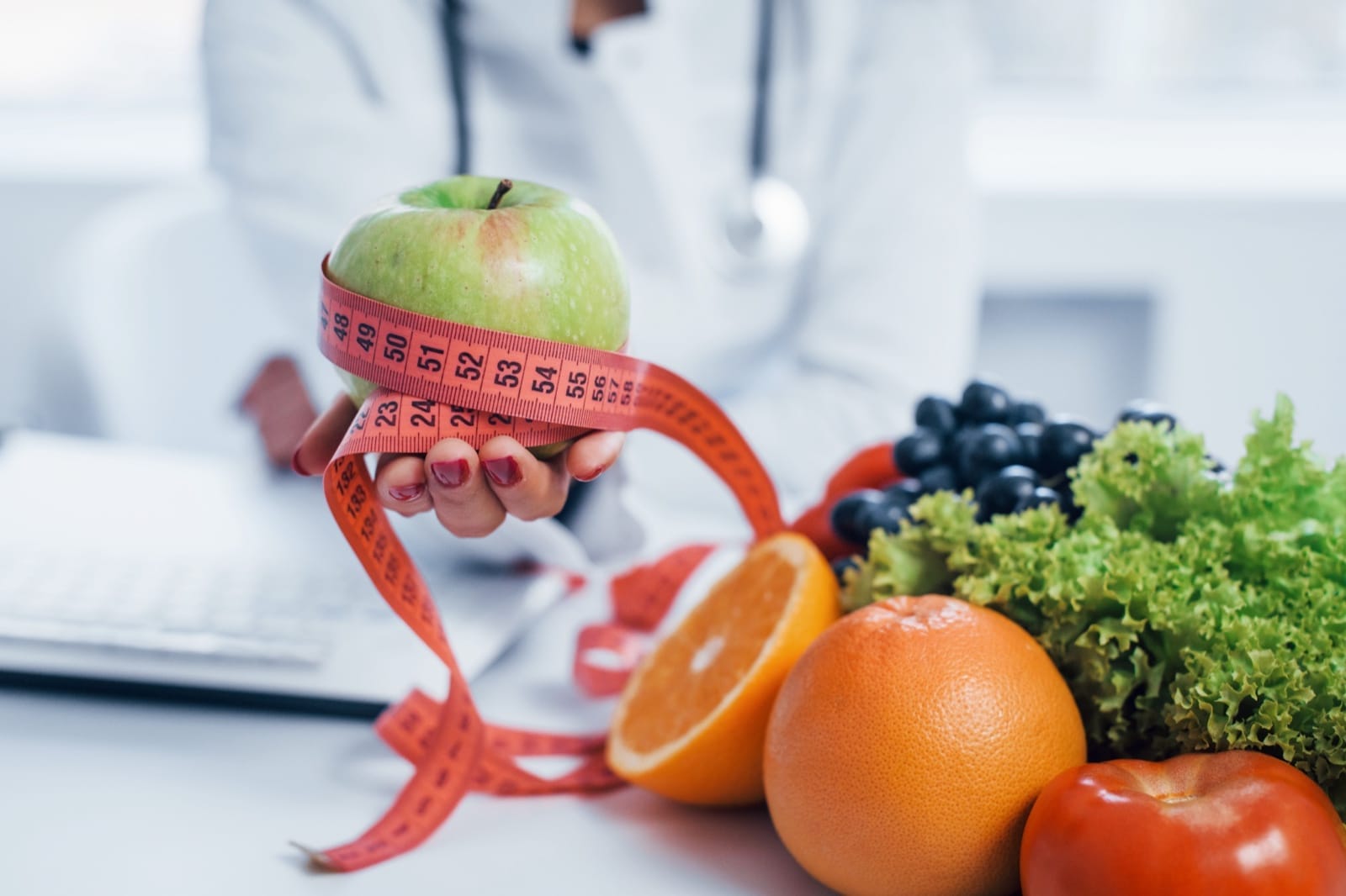 Fresh food and measuring tape used for nutrition planning