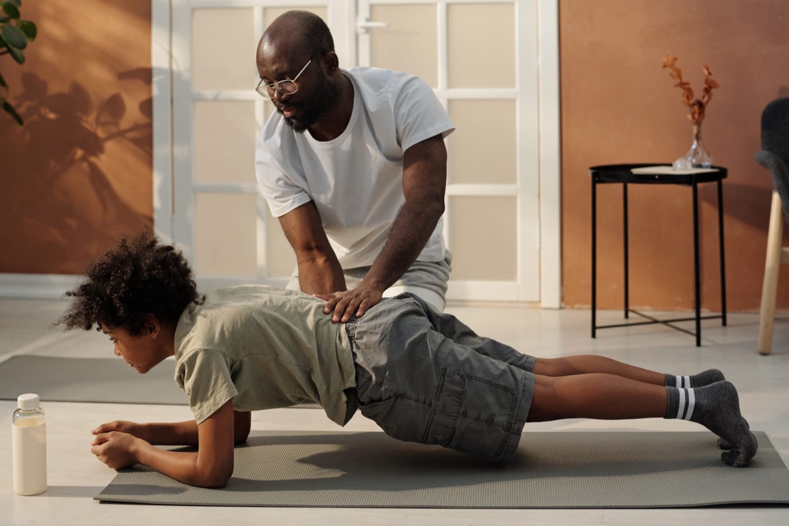 A physiotherapist guiding a patient through an exercise