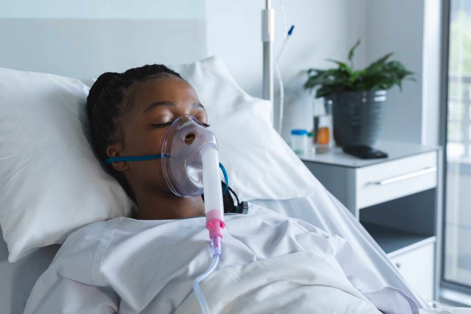 A patient receiving breathing support during a sleep study